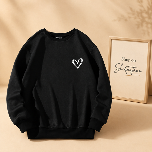 POCKET SHREDED HEART BLACK SWEATSHIRT
